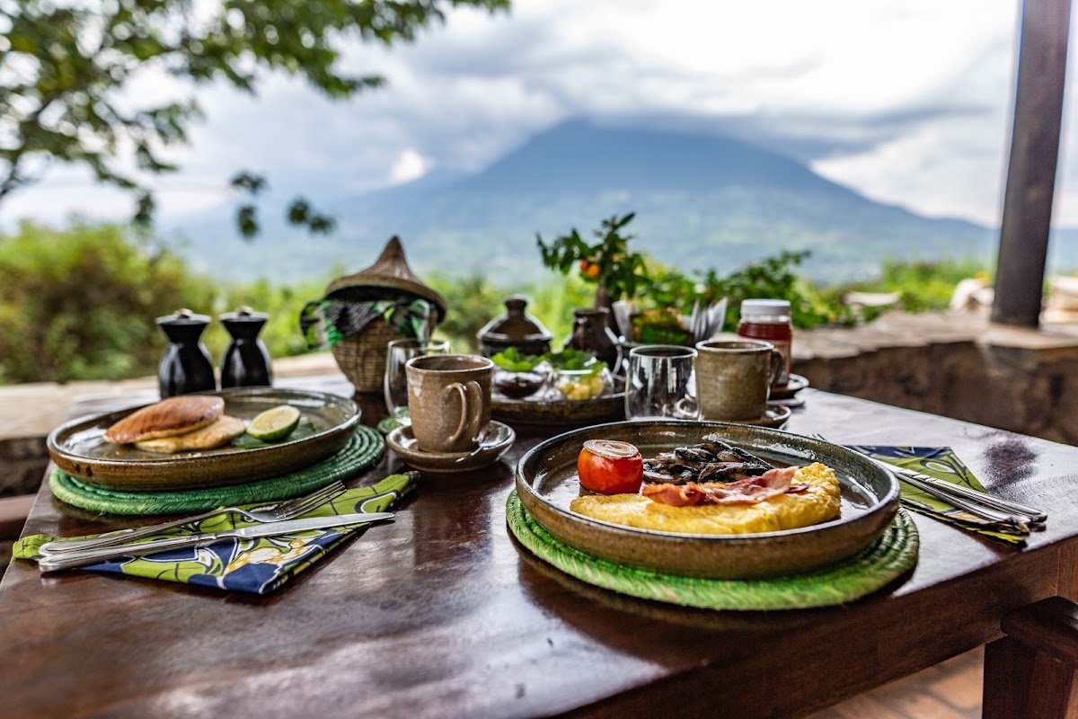 Dining during a Virunga Lodge gorilla safari in Rwanda