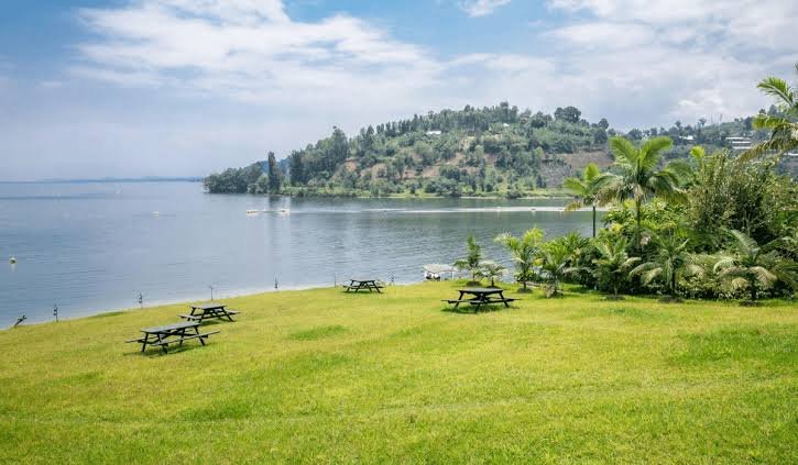 What Is Lake Kivu Famous For scenic views of green hills and calm waters